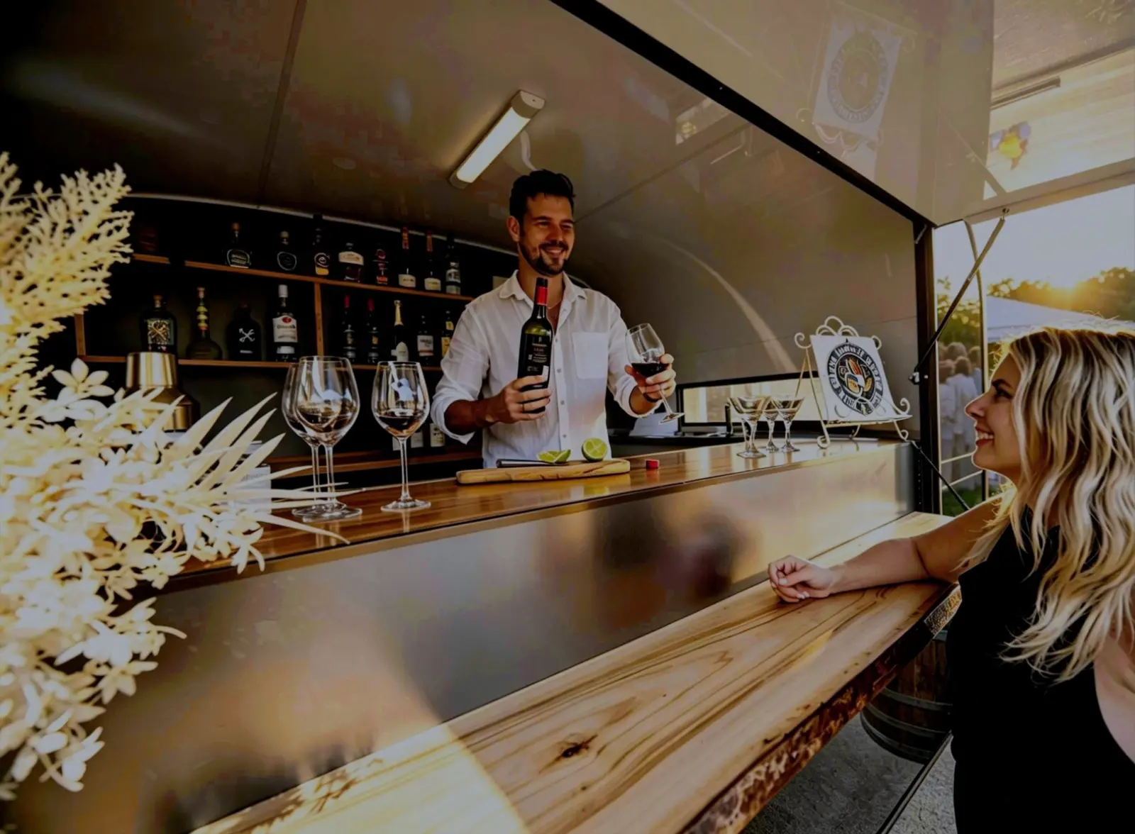 Bartender serving a guest at the mobile bar window