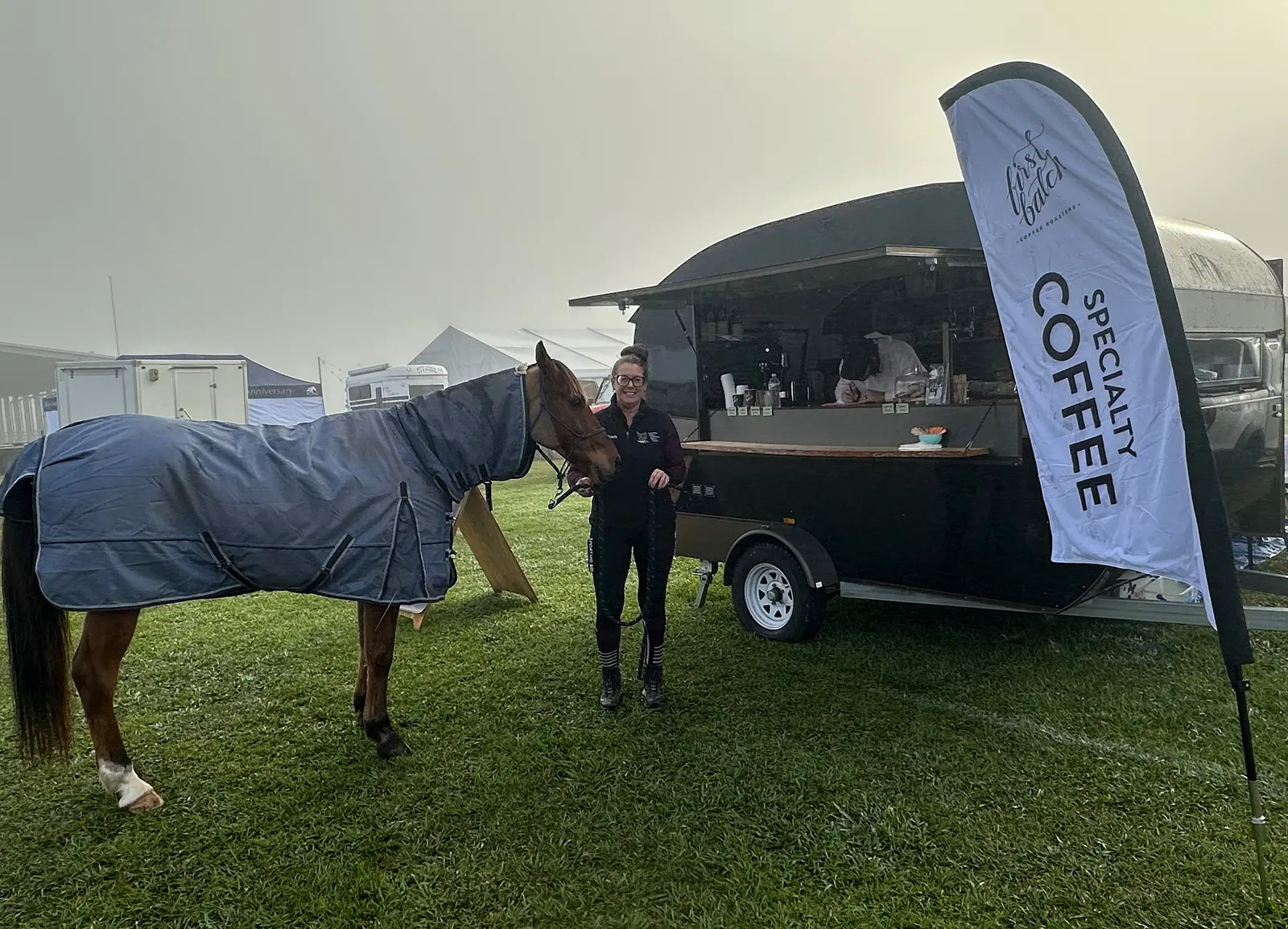 Horse and rider beside the coffee van at the Tom Quilty event