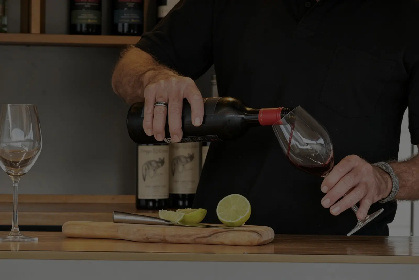 Close-up of red wine being poured at the bar